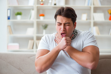 Young man suffering from sore throat
