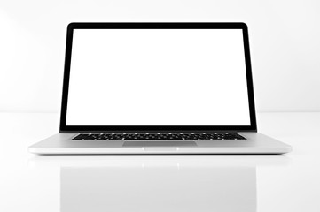 Opened silver color laptop with blank screen isolated on white background. Front view.