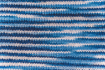Knitting. Texture of blue knitted fabric