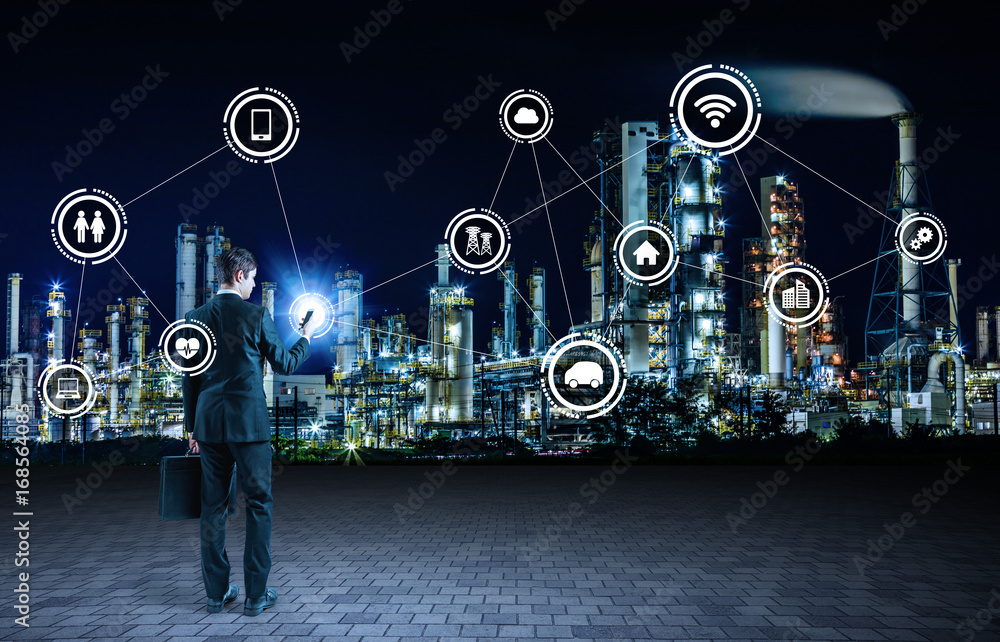 Aufkleber young businessman using smart phone and smart factory concept.