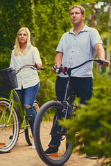 A man and a woman on a bicycle ride.