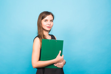 Business Woman Holding A Clip Board on blue background and copy space.