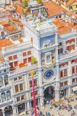 Obraz premium Panoramic view of Venice from the Campanile tower of St. Mark's Cathedral- St. Mark's Square (Piazza San Marco) and Mark's Clock Tower (Torre dell'Orologio).Italy.