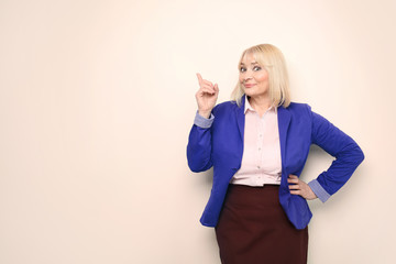 Obraz premium Beautiful senior woman on light background
