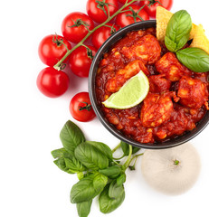 Composition with delicious turkey chili and vegetables on white background