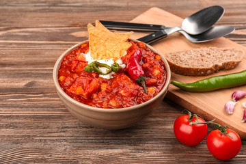 Bowl with delicious turkey chili on table