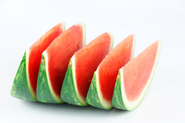 sliced fresh seedless watermelon isolated on white background