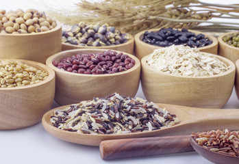 Obraz na płótnie Canvas Cereal grains , seeds, beans on wooden background