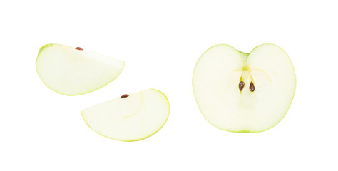 Fresh green apple in half cut and pieces isolated on white background (clipping path included)
