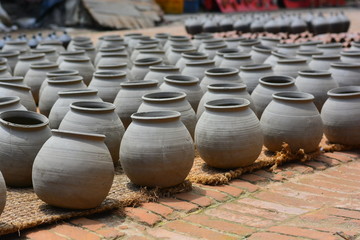 Fototapeta na wymiar row of clay pots dried on sun at pottery square in Bhaktapur nepal