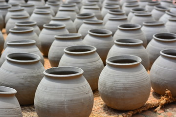 Fototapeta na wymiar row of clay pots dried on sun at pottery square in Bhaktapur nepal