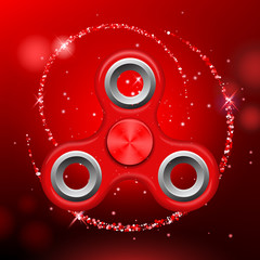 Red colorful spinner on an abstract background with red luminous backdrop. Abstract background with red luminous backdrop. Modern children's toy - spinner.