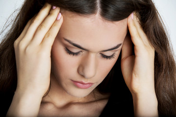 Naklejka premium Young woman with headache.