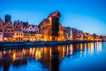 Fototapeta na wymiar View of the old city of Gdansk and the Motlawa River at night. Poland