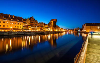 Fototapeta premium View of the old city of Gdansk and the Motlawa River at night. Poland