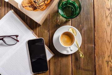Bank notebook laying on the brown table