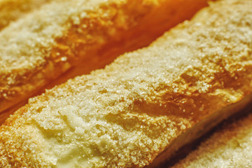 Puff pastry cakes with sugar powder close up