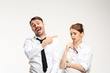 The young man and beautiful woman in business suit at office on white background