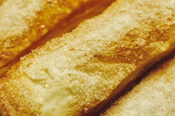 Puff pastry cakes with sugar powder close up