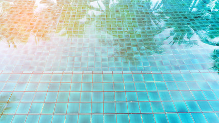 Swimming pool and reflection of coconut tree for background