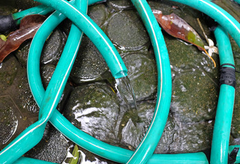 Water flow or leaking on floor by rubber tube.