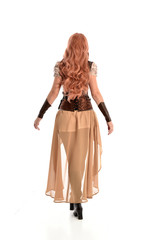 full length portrait of a red haired lady, wearing a steampunk inspired outfit, isolated  on white background.