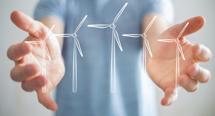 Businessman holding renewable energy sketch