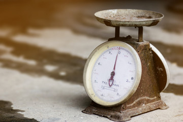 Antique scales put on cement floor.Vintage scales, Old scales.