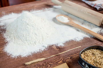 wheat and flour on rustic wooden table