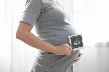 Pregnant  with baby ultrasound film scan .
