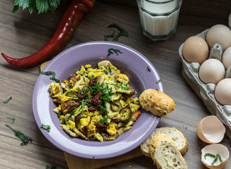 Scrambled egg with dried tomatoes and home baked goods