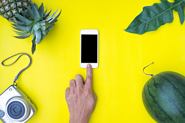 Flat lay hand using phone 