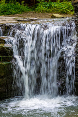 Fototapeta na wymiar Photo of little waterfall in Carpathian mountains