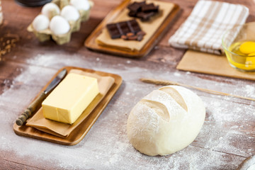 fresh dough on kitchen  rustic wooden table.