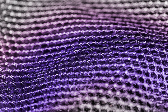Purple abstract background from mesh. Artistic detail of hexagonal grid. Concept for science, research, technology and industry.