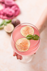 Pink cocktail with fig