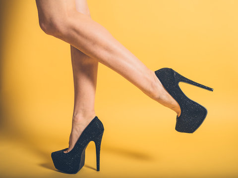Sexy legs of woman wearing black heels
