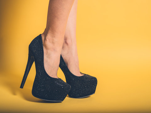 Sexy legs of woman wearing black heels