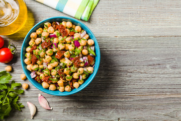 Chickpeas salad with onion and dried tomatoes.