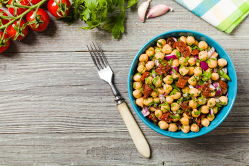 Chickpeas salad with onion and dried tomatoes.