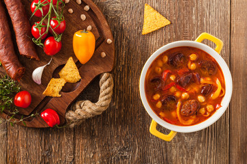Traditional chickpea soup with paprika and chorizo sausage.