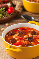 Traditional chickpea soup with paprika and chorizo sausage.