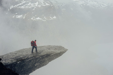Obraz premium Geiranger fjord, Beautiful Nature Norway panorama. Nature photographer tourist with camera shoots.