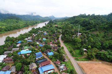 Top view or Aerial view of landscape village countryside and green field, Thailand on green trees...