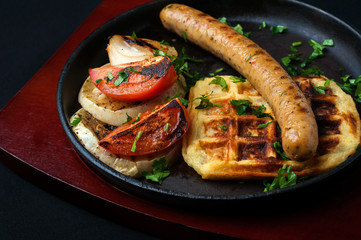 juicy sausage grill on a beautiful pan with vegetables
