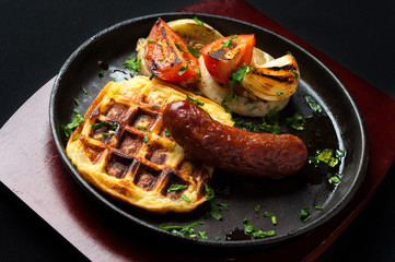 juicy sausage grill on a beautiful pan with vegetables
