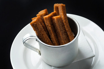 snack to beer on a large wooden plate with the sauce
