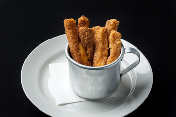 snack to beer on a large wooden plate with the sauce
