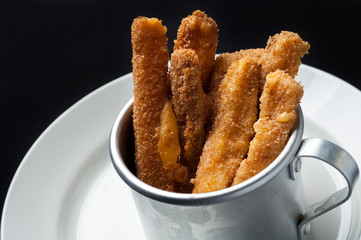 snack to beer on a large wooden plate with the sauce
