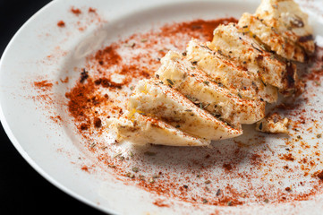 snack to beer on a large wooden plate with the sauce
